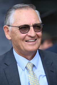 Renowned horse trainer Peter Snowden smiling in a professional setting.